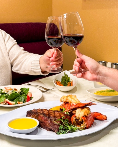 A couple enjoying festive dining in Orlando at Jack's Place Restaurant at Rosen Plaza.