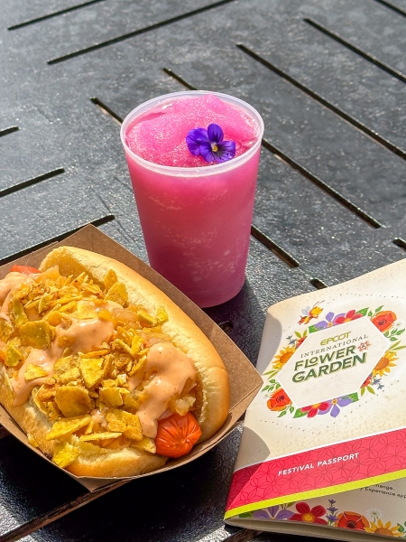 A brightly colored food and beverage display alongside a Festival Passport.