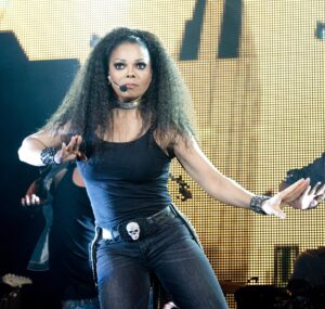 Janet Jackson, who will play Orlando's Amway Center in 2023, dances on stage.