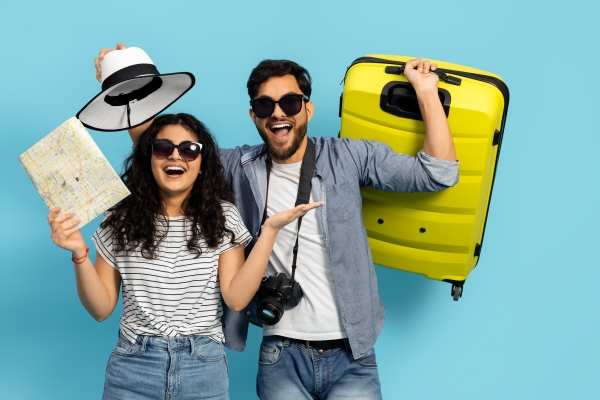 A couple dressed for a spontaneous, last-minute trip to Orlando at Rosen Plaza Hotel on International Drive.