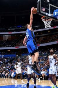 The Orlando Magic playing in a home basketball game.