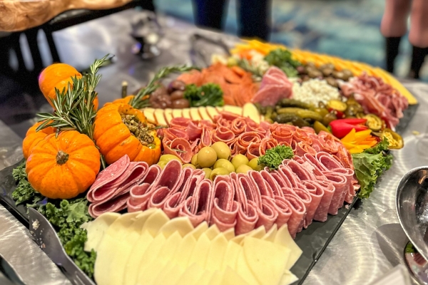 A fall-themed charcuterie board with pumpkins from the Thanksgiving buffet at Rosen Plaza.