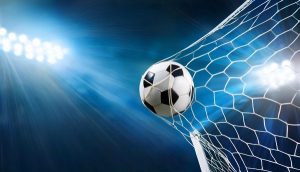 A soccer ball in a soccer net