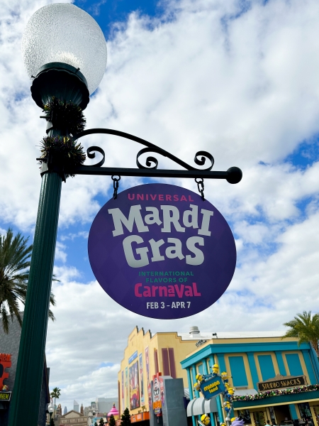 A Universal Mardi Gras: International Flavors of Carnaval sign displayed at Universal Orlando.